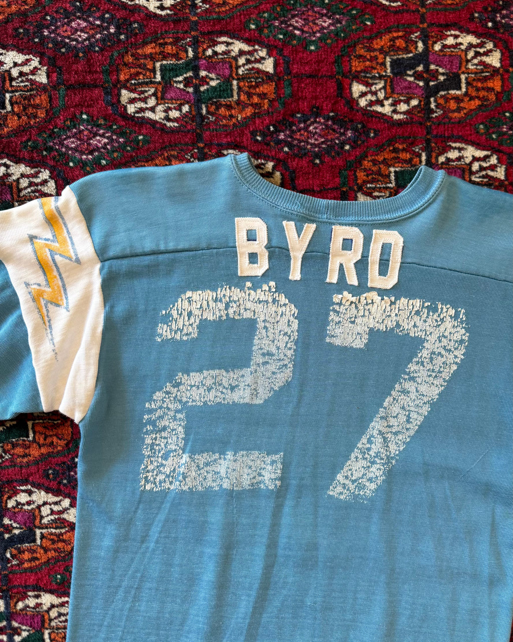 Vintage 1970s/sixties blue faded jersey with lightning bolts ￼