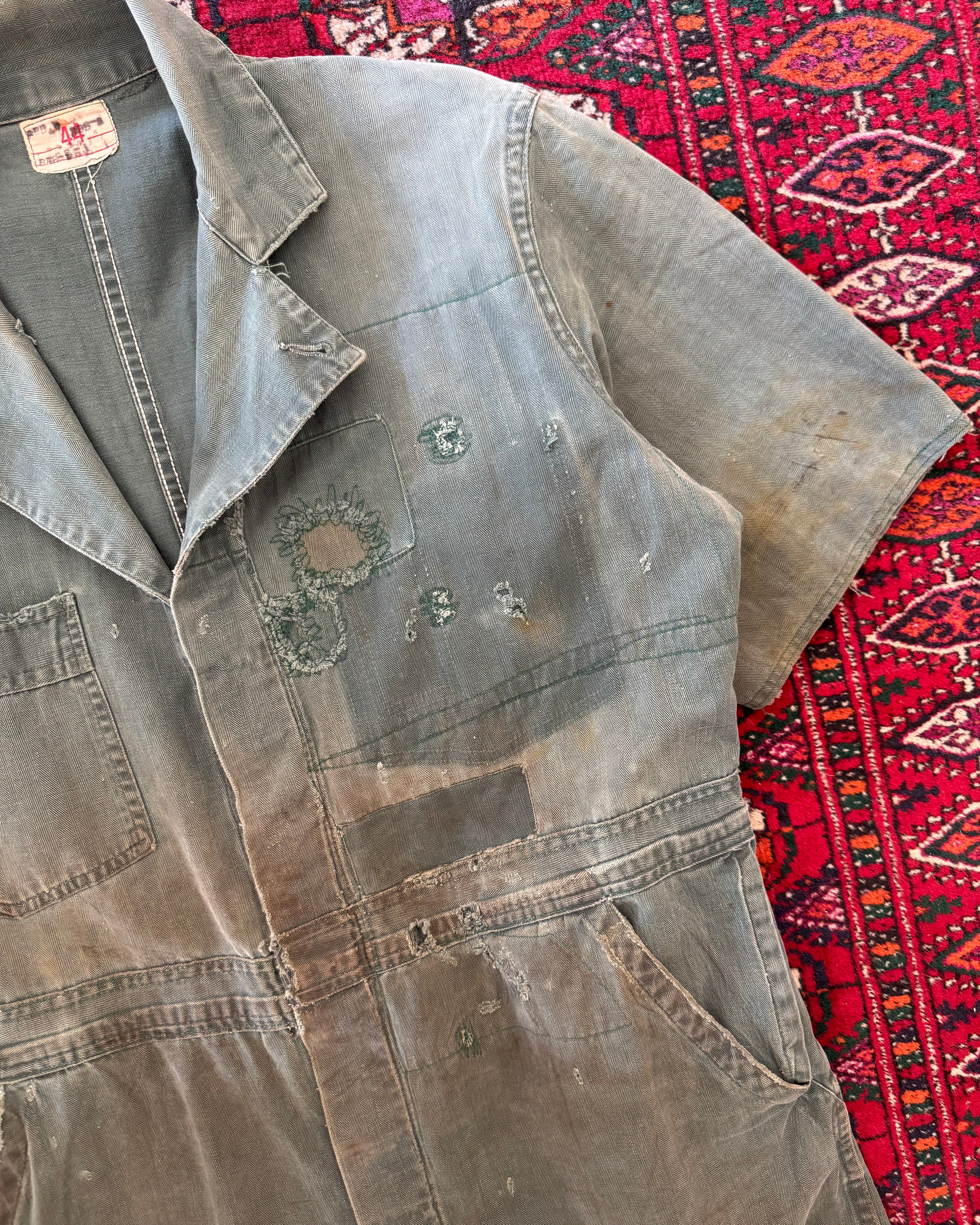 Vintage 1950s union made green herringbone repaired and distressed coveralls, donut button ￼