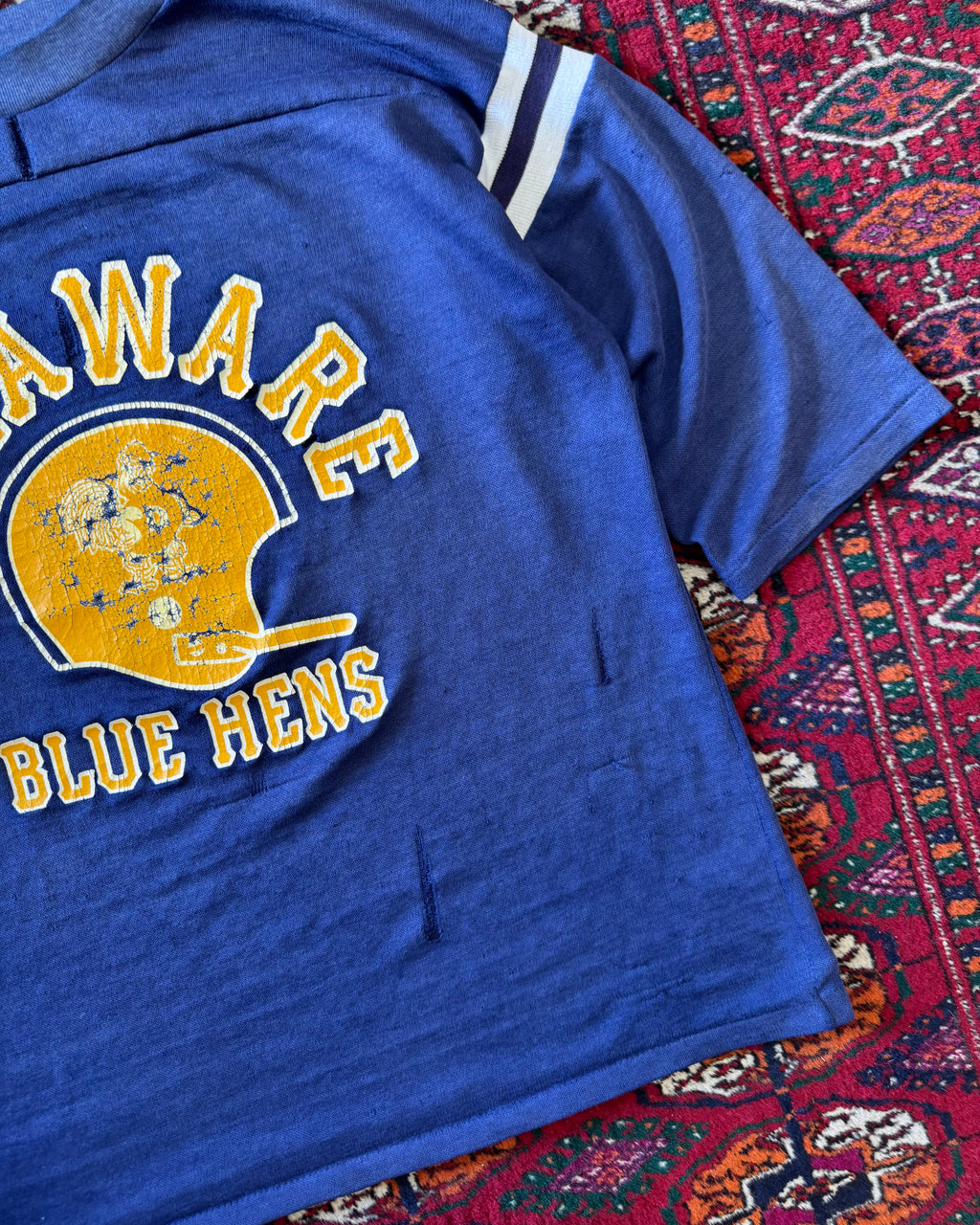 Vintage faded distressed, two tone Delaware blue hens jersey