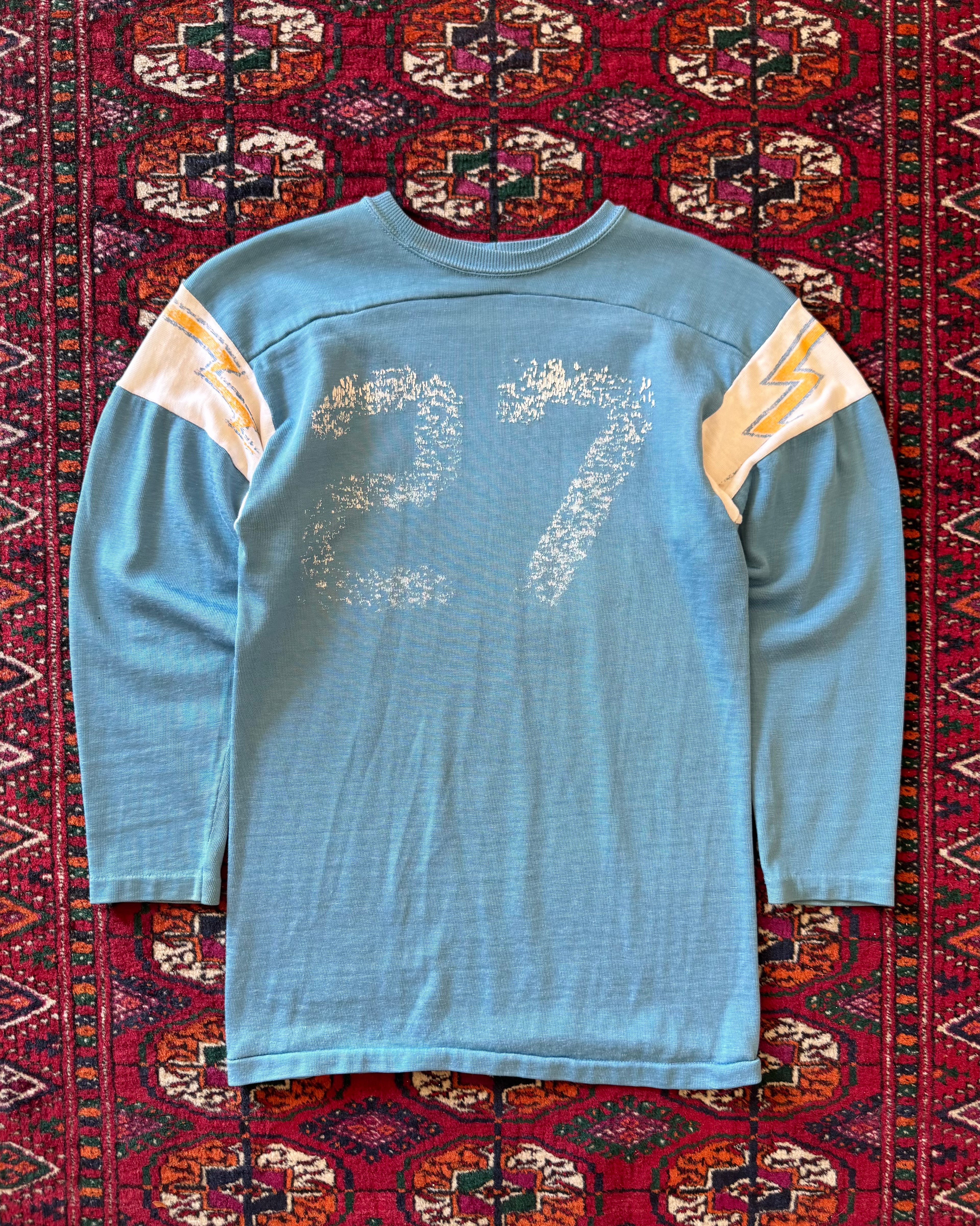 Vintage 1970s/sixties blue faded jersey with lightning bolts ￼