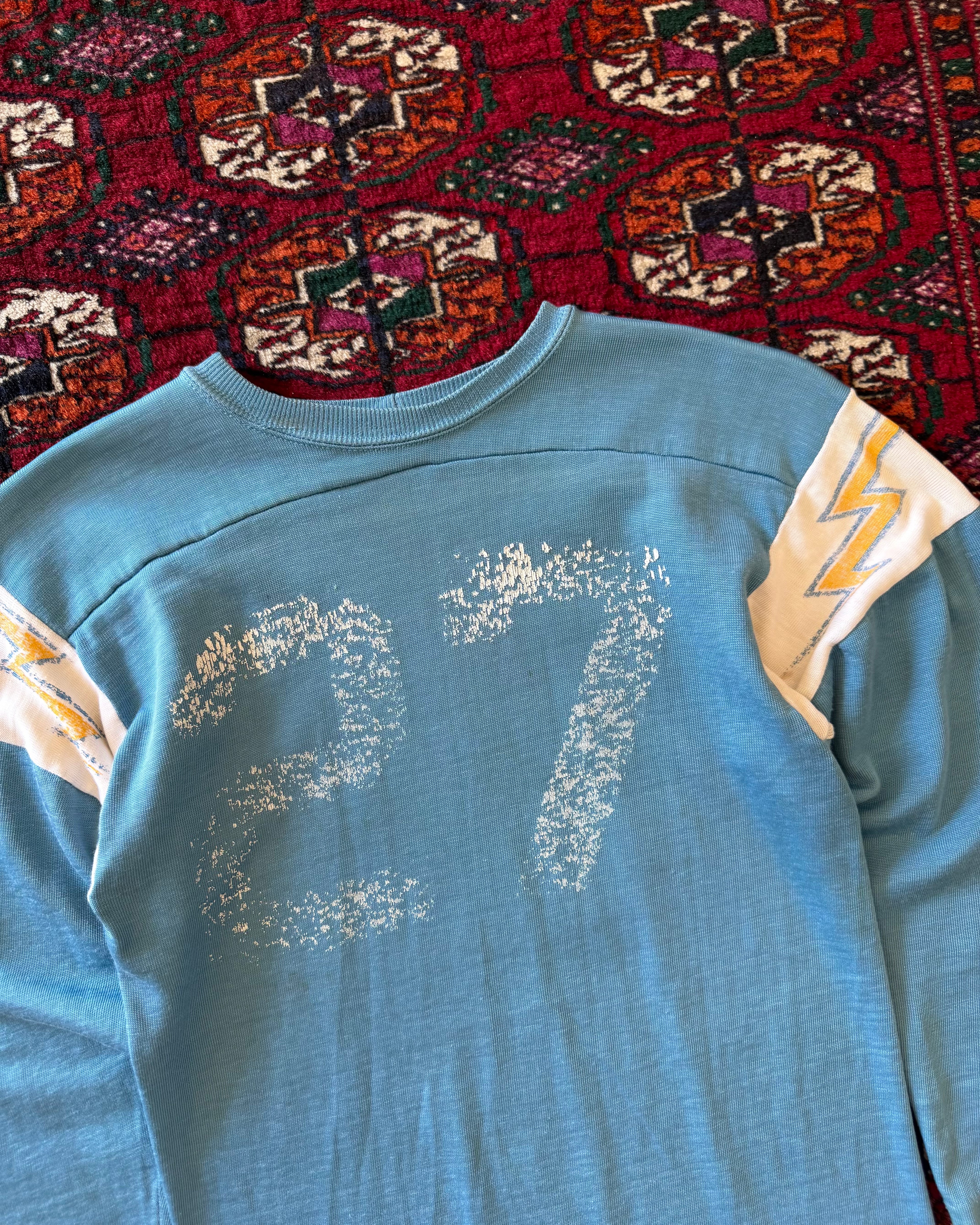 Vintage 1970s/sixties blue faded jersey with lightning bolts ￼